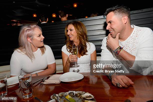 Dancer Lacey Schwimmer, comedian/actress and event host Heather McDonald and musician Frankie Moreno attend the fourth annual White Party at STK at...