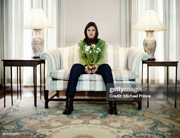 woman sitting with flowers - michael sit stock pictures, royalty-free photos & images