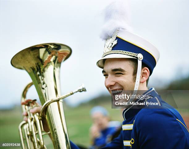 high school band member laughing - banda de marcha fotografías e imágenes de stock