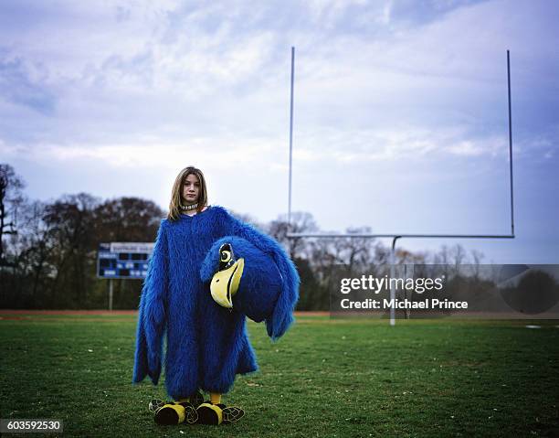 high school mascot on football field - mascotte photos et images de collection