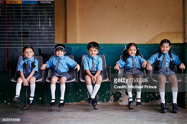 students in school - school uniform stock pictures, royalty-free photos & images