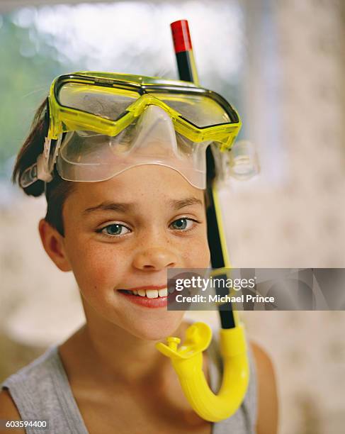 boy in snorkeling mask and snorkel - vintage scuba mask stock pictures, royalty-free photos & images