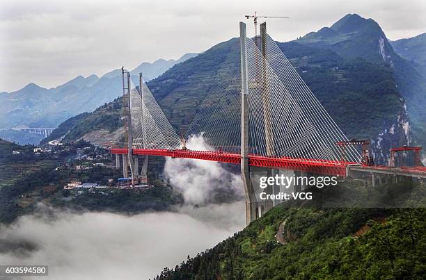 Construction work on the Beipan River expressway bridge on September 10, 2016 in Bijie, Guizhou Province of China. The 1,341.4-meter-long Beipan...