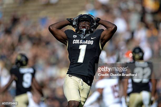 Defensive back Afolabi Laguda of the Colorado Buffaloes throw his hands in the air in frustration after nearly interception a pass against the Idaho...