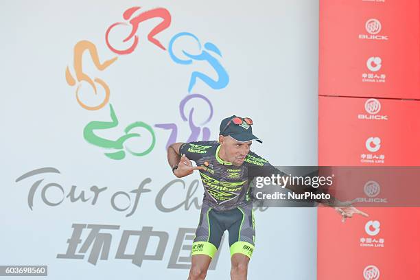 Mauricio Ortega from RTS-Santic Racing Team calebrates after finishing third in the third stage, 114.7 km Chongqing Banan circuit race, during the...