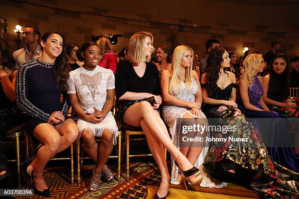 Aly Raisman, Simone Biles, Ireland Baldwin, Allie Simpson, Kelli Berglund, Jordyn Jones, and Landry Bender attend the Sherri Hill presentation at...