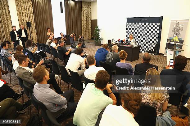 Angelique Kerber of Germany talks to the media during a press conference after arriving as new Tennis World number One and winner of the US Open at...