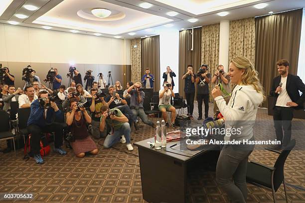 Angelique Kerber of Germany talks to the media during a press conference after arriving as new Tennis World number One and winner of the US Open at...