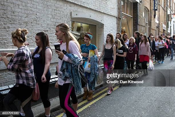 Over a hundred people queue outside Pineapple Studios for an audition for 'Disney Character Look-alikes' on September 13, 2016 in London, England....