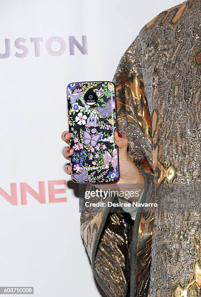 Actress Zhang Li, phone detail, poses backstage at the Vivienne Tam fashion show during New York Fashion Week: The Shows at The Arc, Skylight at...