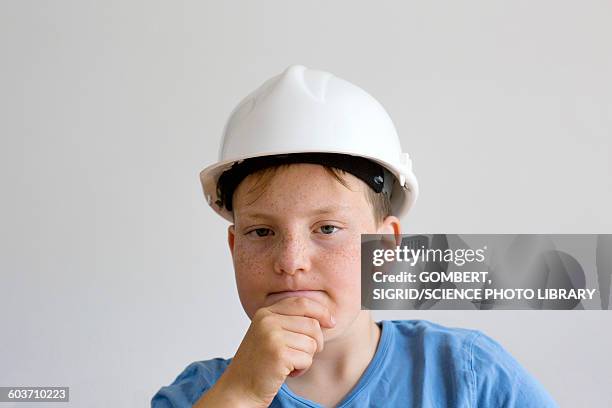 boy wearing hard hat - boy in hard hat photos et images de collection