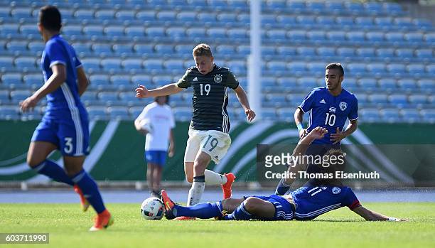 Kilian Ludewig of Germany and Eden Karzev of Israel vie for the ball during the Under 17 four nations tournament match between U17 Germany and U17...
