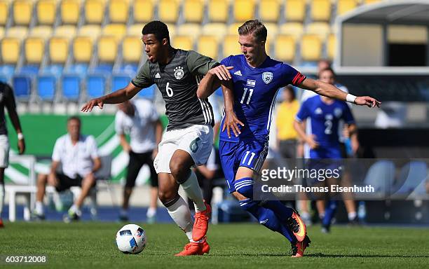 Jean-Manuel Mbom of Germany and Eden Karzev of Israel vie for the ball during the Under 17 four nations tournament match between U17 Germany and U17...