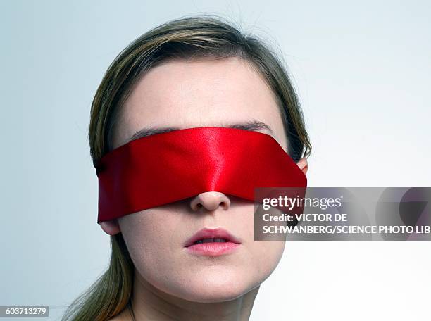 woman wearing red blindfold - blinddoek stockfoto's en -beelden