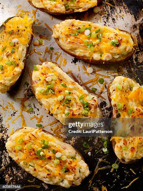 twice baked, stuffed potatoes with cheese and green onion - side salad stock pictures, royalty-free photos & images