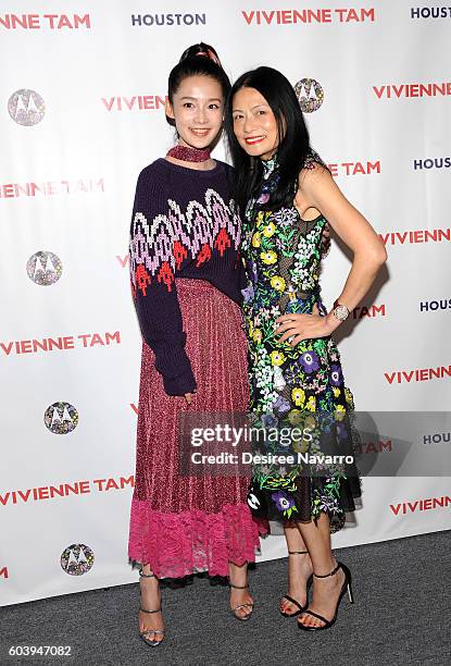 Designer Vivienne Tam and actress Qin Li pose backstage at the Vivienne Tam fashion show during New York Fashion Week: The Shows at The Arc, Skylight...