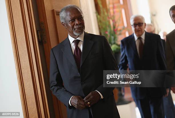 Former U.N. General Secretary Kofi Annan and former Algerian U.N. Diplomat Lakhdar Brahimi arrive to meet with German President Joachim Gauck at...