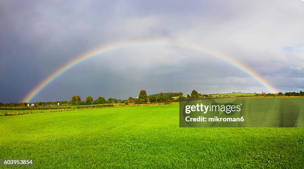 rainbow landscape in beautiful  irish landscape scenery.co tipperary ireland. - lumen field stockfoto's en -beelden