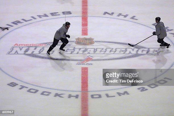 Forward Peter Forsberg, left, of the Colorado Avalanche skates across the ice in a training camp session during the 2001 NHL Challenge Series at the...