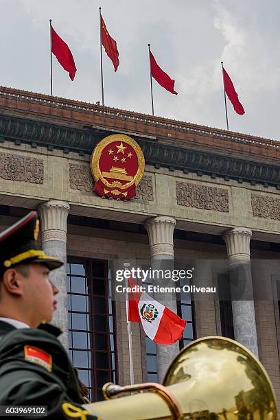 The Peruvian flag is raised before the welcoming ceremony of Peruvian President outside the Great Hall of the People on September 13, 2016 in...