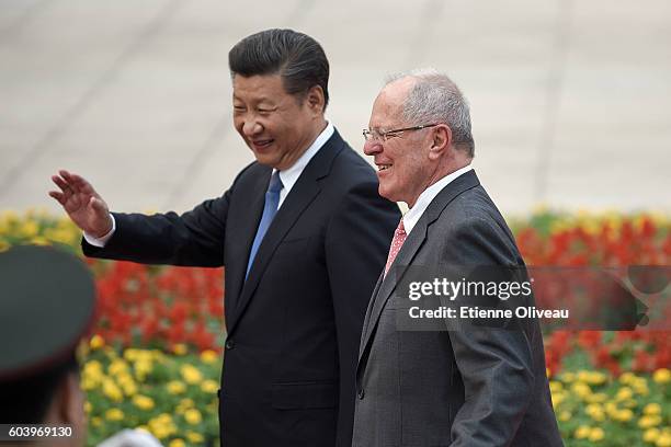 Chinese President Xi Jinping accompanies Peruvian President Pedro Pablo Kuczynski during a welcoming ceremony outside the Great Hall of the People on...