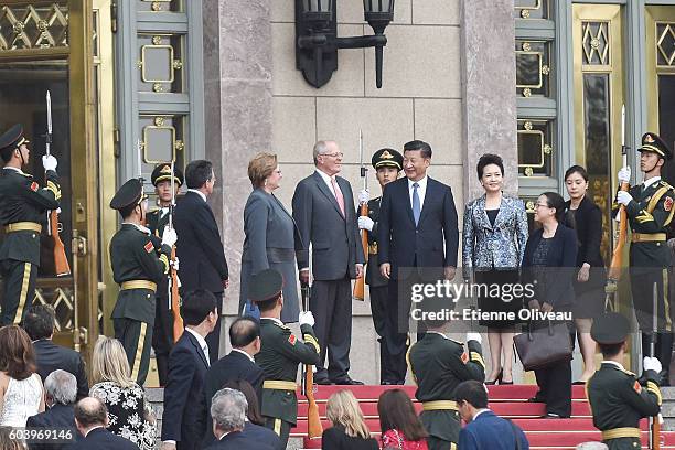 Chinese President Xi Jinping and his wife Peng Liyuan talk with Peruvian President Pedro Pablo Kuczynski and his wife Nancy Lange after a welcoming...