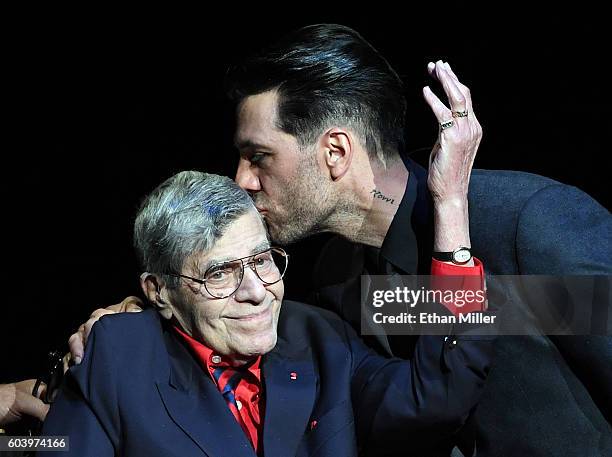 Entertainer Jerry Lewis is kissed by illusionist Criss Angel during Criss Angel's HELP charity event at the Luxor Hotel and Casino benefiting...