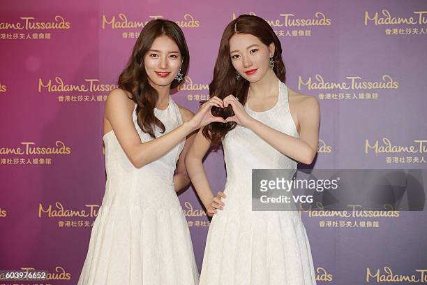 South Korea singer and actress Bae Suzy poses with her wax figure on September 13, 2016 in Hong Kong, China.