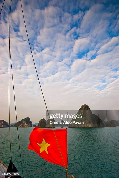 vietnam, halong bay, vietnamese flag - vietnam flag stock pictures, royalty-free photos & images