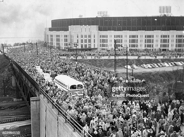 Elevated view of spectators as they leave Municipal Stadium after a football game between the Cleveland Browns and the San Francisco 49ers,...