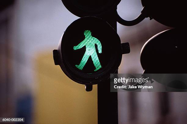 green man on traffic light - grüne ampel stock-fotos und bilder