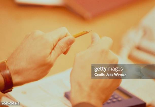 man breaking pencil - broken calculator stock pictures, royalty-free photos & images