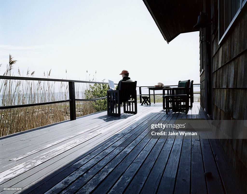 Man on Deck using Laptop