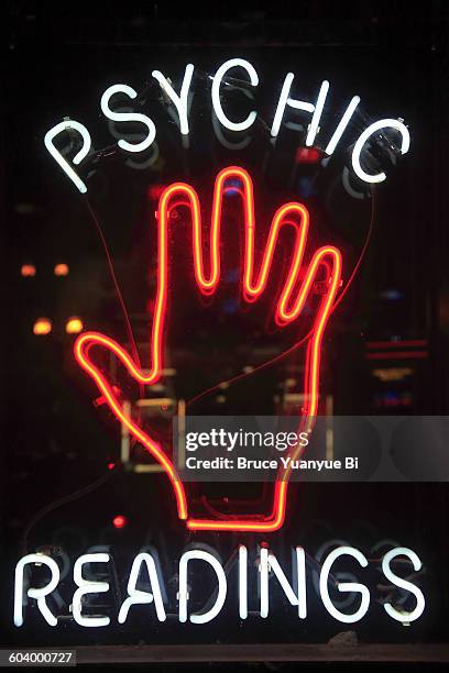 a neon sign on broadway - fortune telling stock pictures, royalty-free photos & images