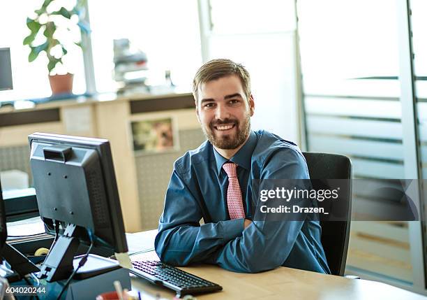 formal businessman in office with businesswoman writing eu project proposal - file clerk stock pictures, royalty-free photos & images