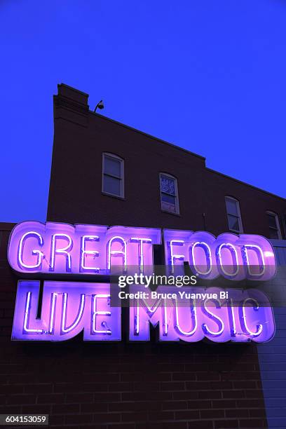 neon signs on a building - memphis tennessee stock pictures, royalty-free photos & images
