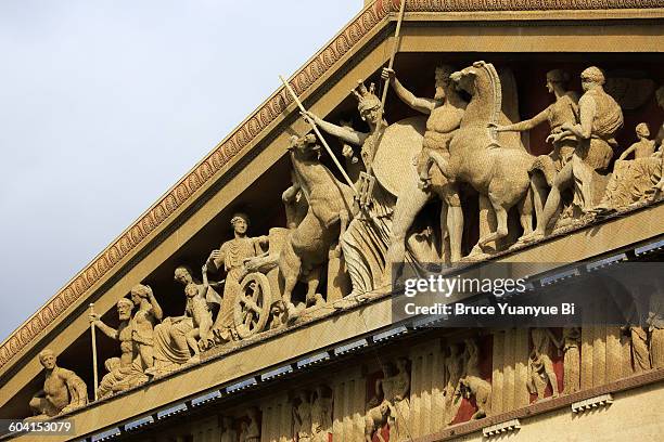 a closed up view of the pediment of the parthenon - tympanon stock-fotos und bilder