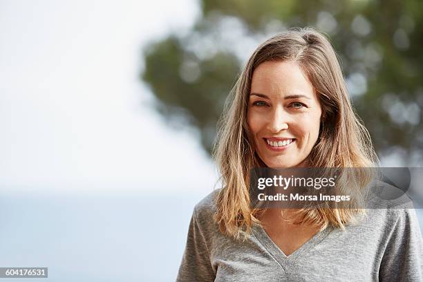 portrait of mature woman smiling - 40 ストックフォトと画像