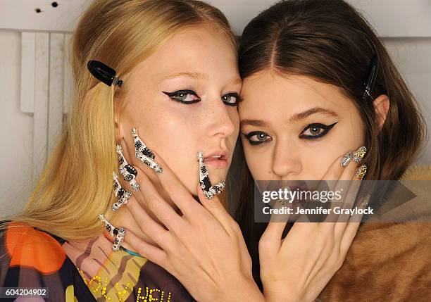 Models prepare backstage at Libertine Spring/Summer 2017 fashion show during NEw York Fashion Week on September 12, 2016 in New York City.