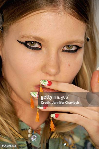 Model prepares backstage at Libertine Spring/Summer 2017 fashion show during NEw York Fashion Week on September 12, 2016 in New York City.