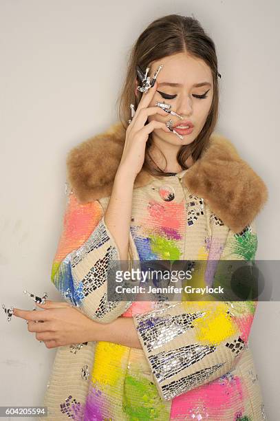 Model prepares backstage at Libertine Spring/Summer 2017 fashion show during NEw York Fashion Week on September 12, 2016 in New York City.
