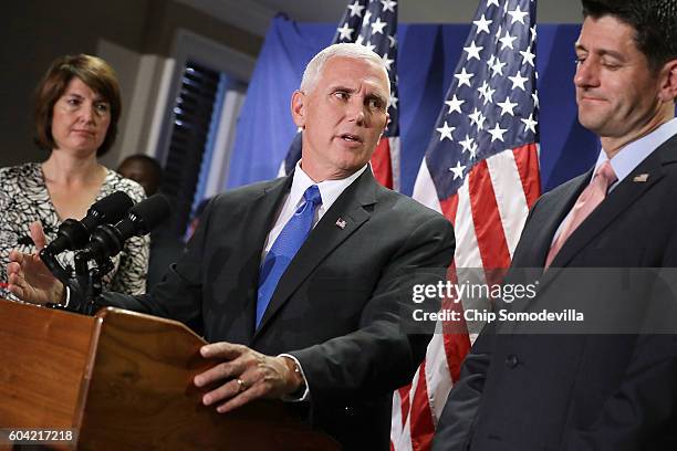 Republican vice presidental nominee Gov. Mike Pence answers reporters' questions during a news conference with Speaker of the House Paul Ryan and...