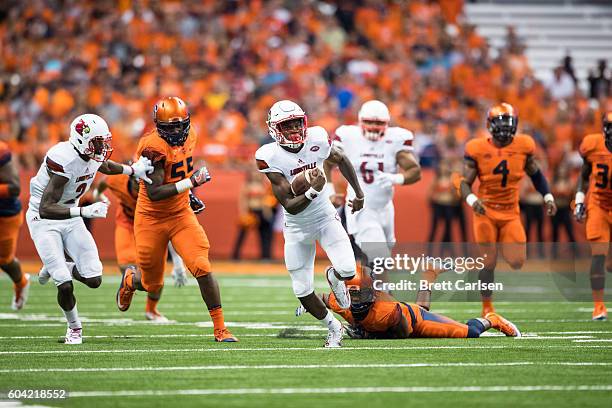 Lamar Jackson of the Louisville Cardinals carries the ball for a touchdown during the first half against the Syracuse Orange on September 9, 2016 at...