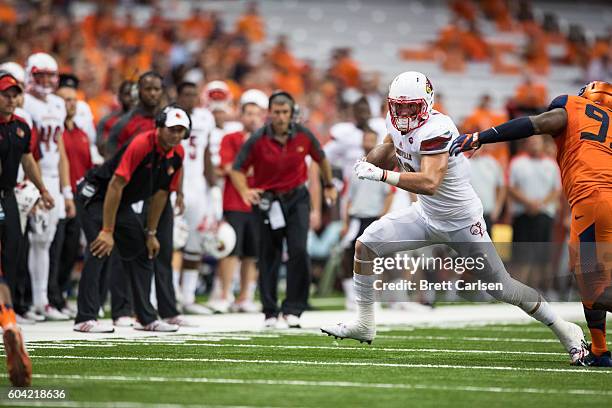 Cole Hikutini of the Louisville Cardinals runs with the ball during the second half against the Syracuse Orange on September 9, 2016 at The Carrier...
