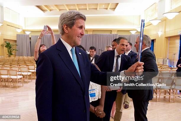 Secretary of State John Kerry takes a photo with a "Twitter Mirror", before delivering welcoming remarks to attendees at the Global Entrepreneurial...