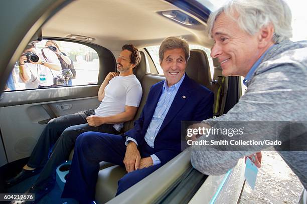 Secretary of State John Kerry chats with Google Co-Founder Sergey Brin and a leader of Google's Self-Driving Car Project while sitting inside one of...