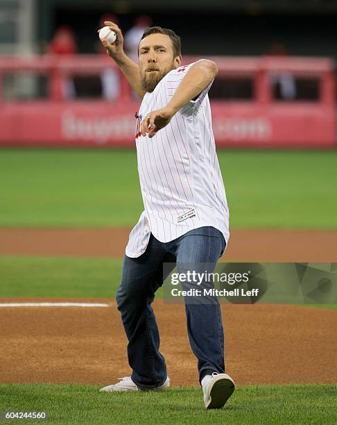 Wrestler Daniel Bryan throws out the first pitch prior to the game between the Pittsburgh Pirates and Philadelphia Phillies at Citizens Bank Park on...