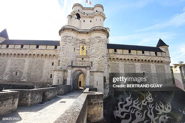 Picture taken on September 13, 2016 in the Chateau de Vincennes near Paris shows French artist Zevs' "Proper Graffiti" work of art during his "noir...