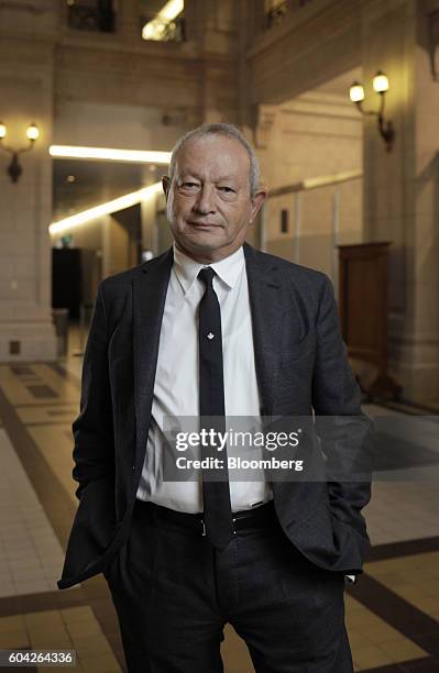 Naguib Sawiris, chairman and chief executive officer of Orascom Telecom Media And Technology Holding SAE, stabnds for a photograph after a Bloomberg...