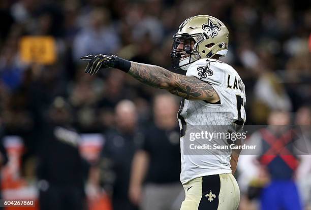 James Laurinaitis of the New Orleans Saints stands on the field during a game against the Oakland Raiders at the Mercedes-Benz Superdome on September...